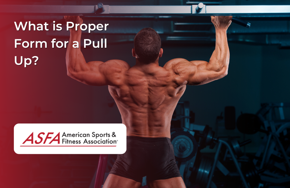 A muscular man performs a pull-up in a gym, displaying a strong back and arms.