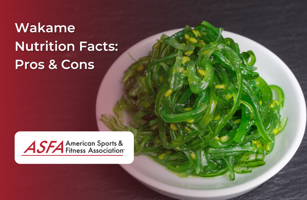 A plate of fresh green wakame seaweed salad garnished with sesame seeds.