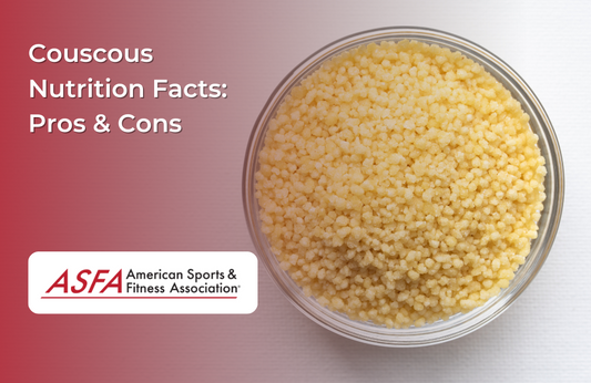 A bowl filled with small, round couscous grains on a white surface.