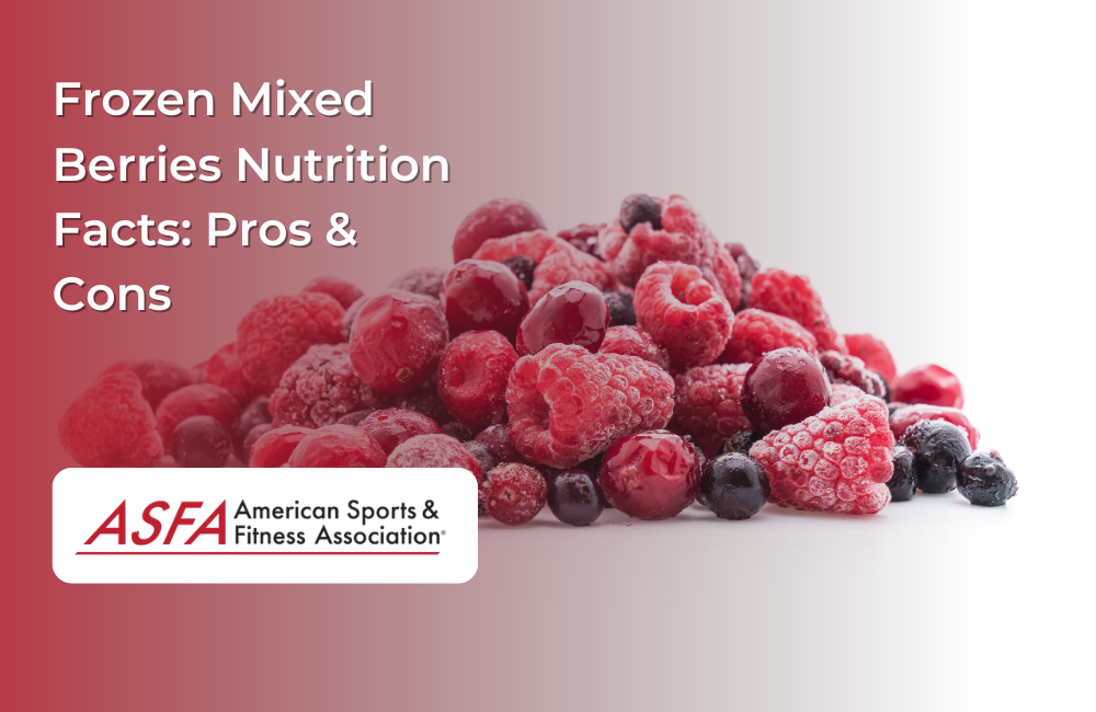 A heap of frozen mixed berries, including raspberries, blackberries, and blueberries, against a white background.