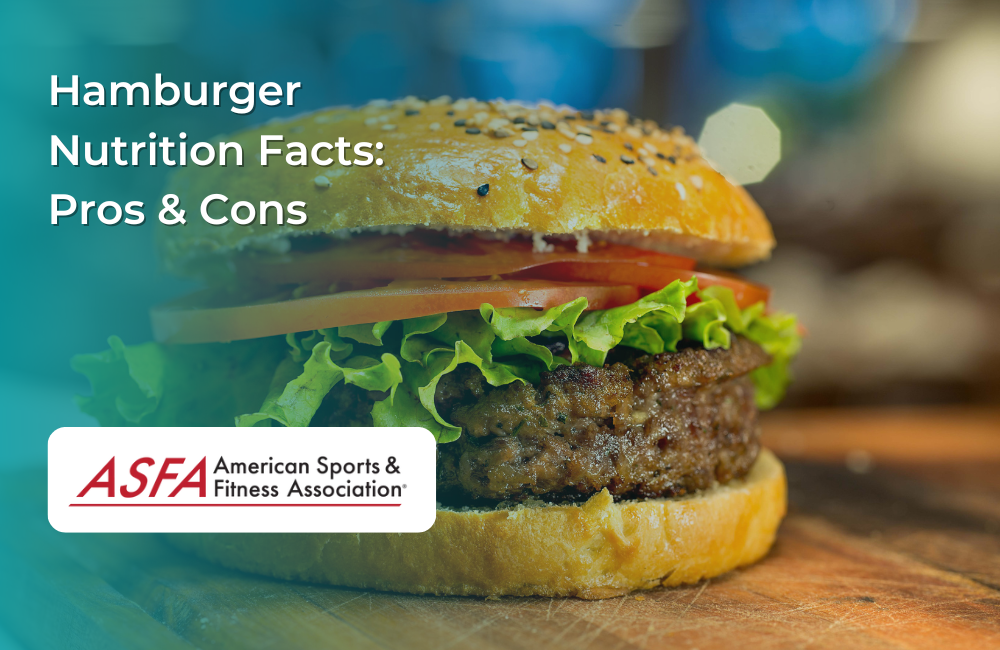 A freshly made hamburger with a sesame seed bun, lettuce, tomato, and a beef patty, set on a wooden surface.