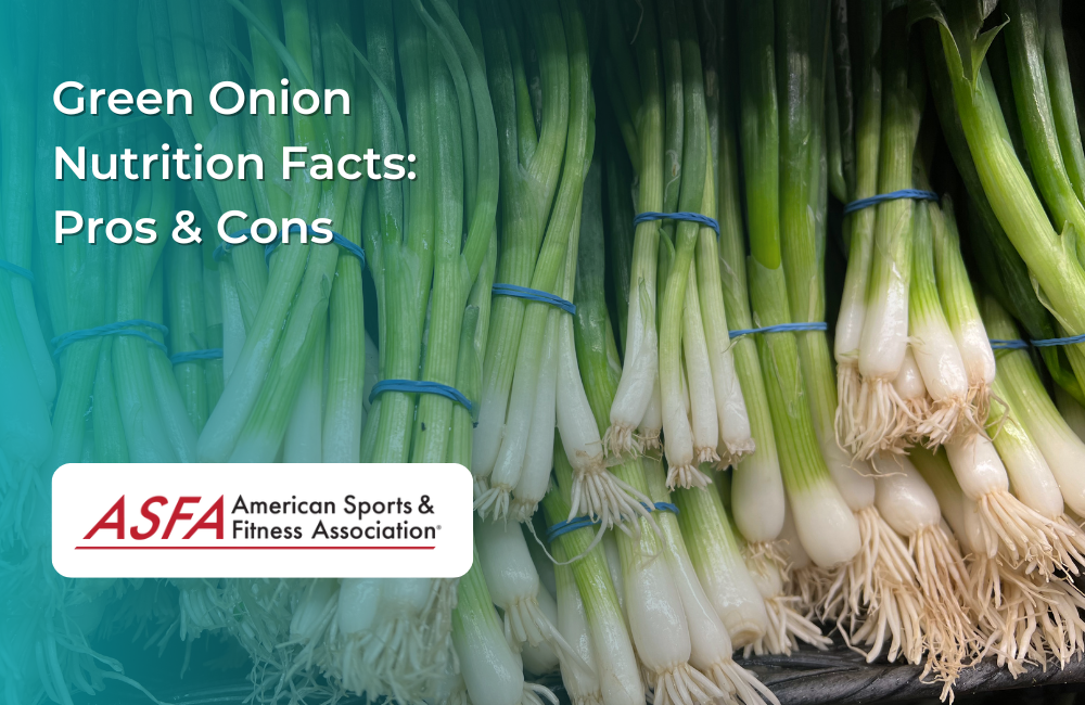 A bundle of fresh green onions tied with blue rubber bands, displayed in a grocery store.