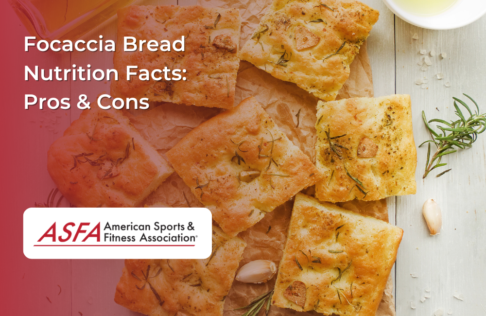 Golden focaccia bread pieces with garlic, rosemary, and olive oil on parchment paper.