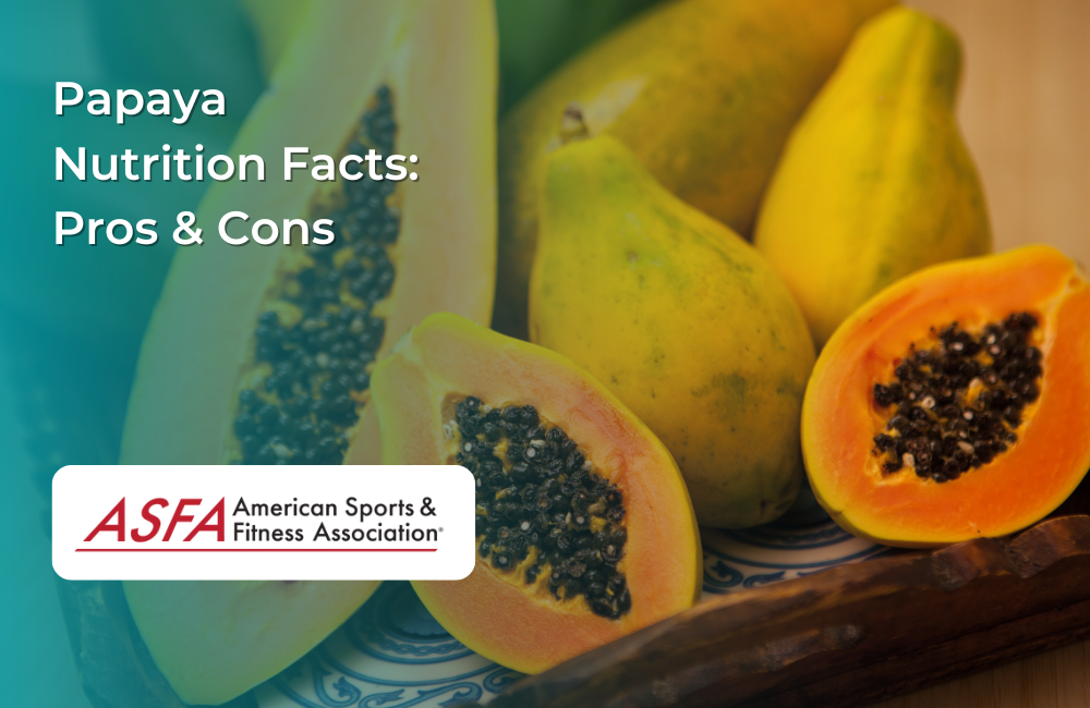 Ripe papayas cut open to reveal their seeds, placed on a wooden surface.