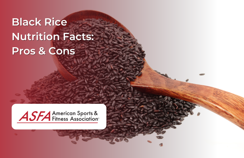 A wooden spoon scooping black rice with a gradient background.