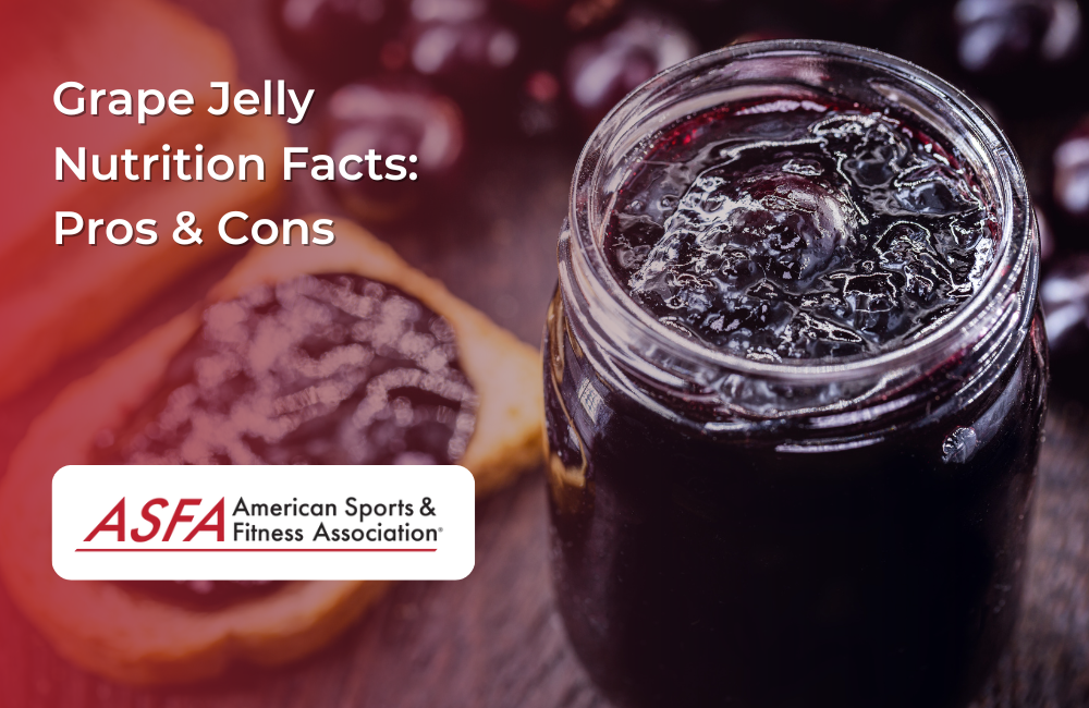 A jar of dark grape jelly with toast in the background.