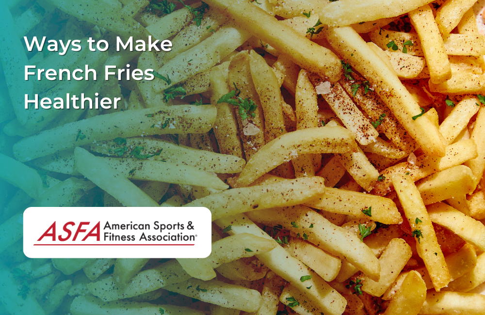 A close-up of golden, seasoned French fries garnished with herbs.