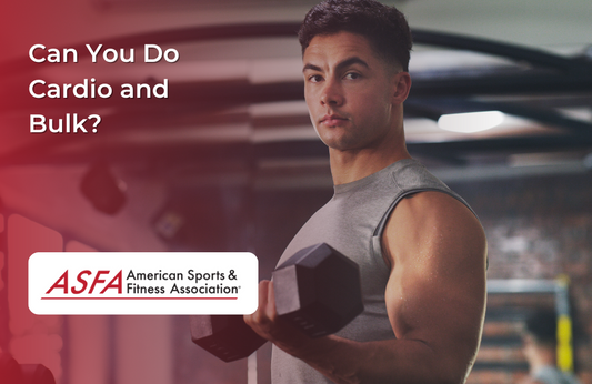A man holding a dumbbell, working out in a gym environment.