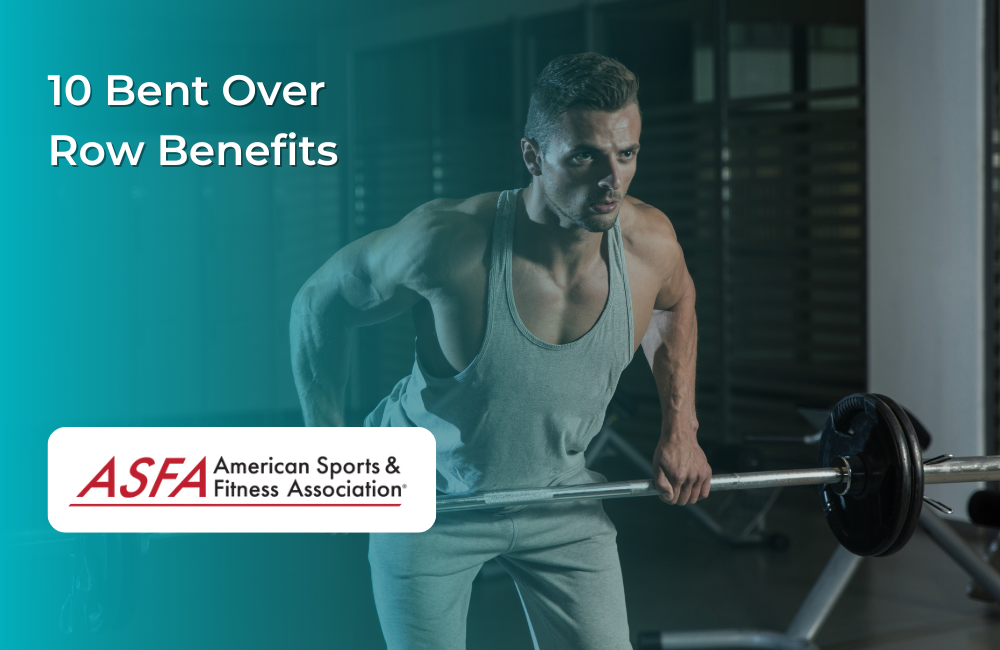 A man in a gray tank top and sweatpants working out with a barbell in a gym.