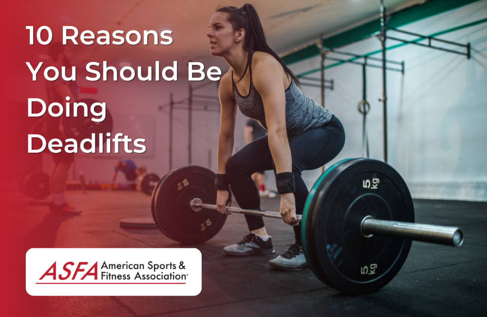 A woman performing a deadlift in an inside gym. 