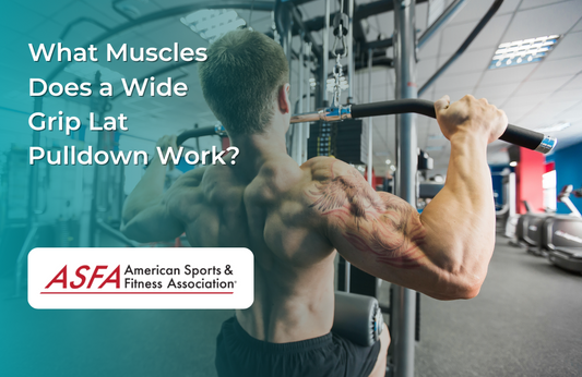 A muscular man with a tattooed arm performing a wide grip lat pulldown in a gym, facing away from the camera, pulling down a bar attached to a cable machine.