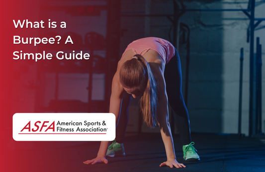 Lady doing a burpee in a gym.