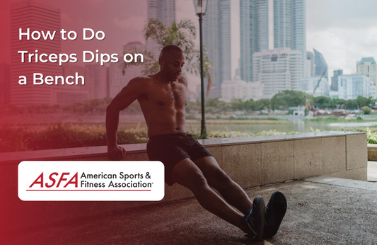 A shirtless man outdoors performing triceps dips on a concrete bench with a city skyline and water in the background.