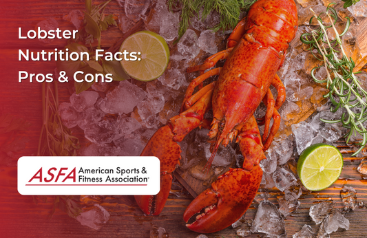  A whole red lobster on ice with herbs and a lime slice.