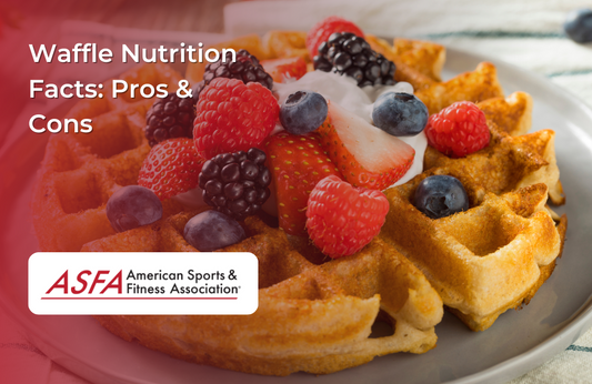 A crispy waffle topped with fresh strawberries, raspberries, blackberries, and a dollop of whipped cream.