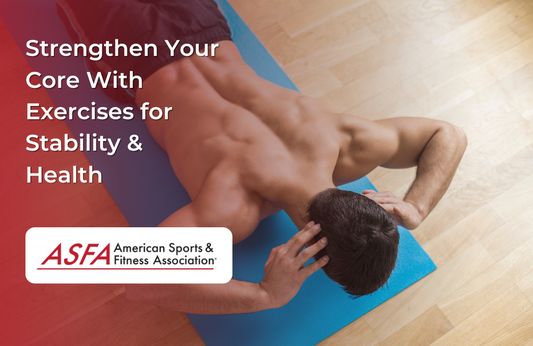 Top view of a man doing a crunch on a blue mat on a wooden floor.