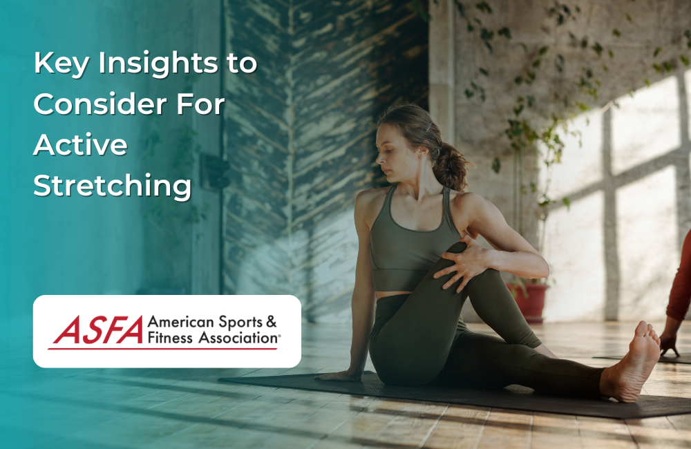 A woman in workout clothing performing a seated spinal twist on a yoga mat in a naturally lit room.