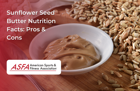 A bowl of sunflower seed butter surrounded by sunflower seeds on a wooden surface.