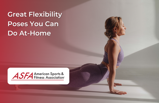 A person in a yoga pose, lying on the floor with their body arched upward in a stretching pose.