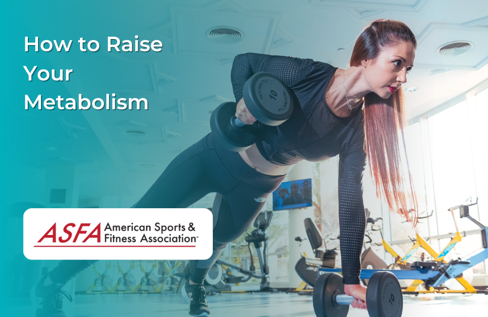 Lady with headphones on planking with one hand and dumbells in her hands in a gym.