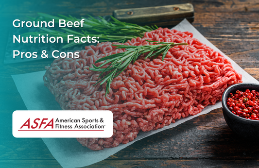 A mound of fresh ground beef on parchment paper, garnished with a sprig of rosemary.