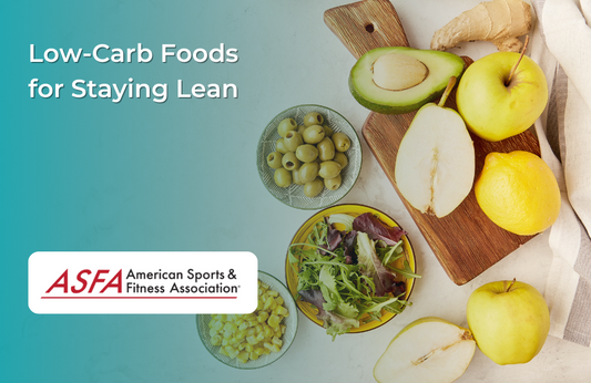 Image of various low-carb foods including avocados, apples, olives, leafy greens, and pears on a cutting board.