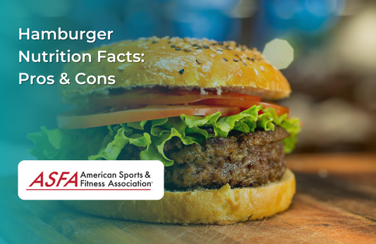  A freshly made hamburger with a sesame seed bun, lettuce, tomato, and a beef patty, set on a wooden surface.