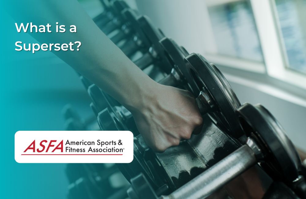 Person grabbing a dumbbell from a rack.