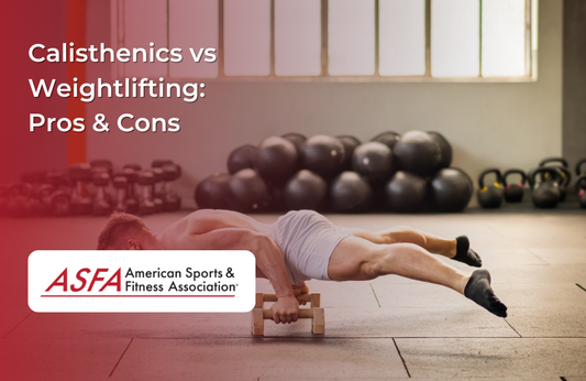A person performing a bodyweight push-up on a wooden floor with a pair of parallettes.
