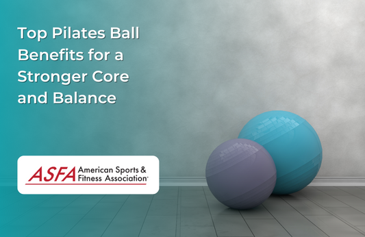 Two Pilates balls, one blue and one purple, resting on a light-colored floor near a wall.