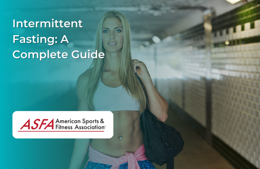 Woman in white shirt holding a black gym bag posing in gym.