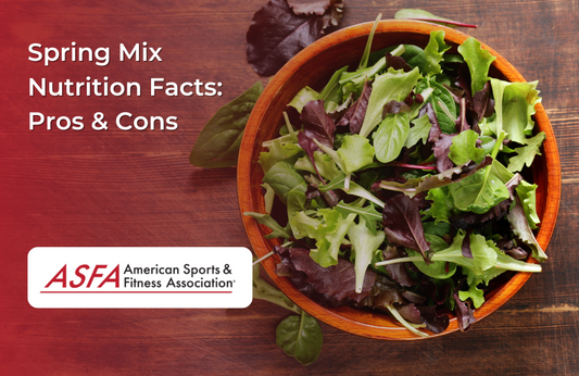  A wooden bowl filled with a mixture of leafy greens, sitting on a rustic wooden surface.