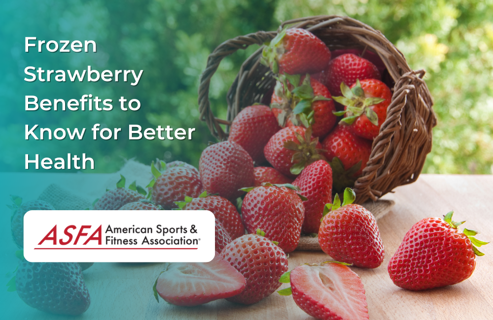 A basket of strawberries spilling onto a wooden surface, with some whole and some sliced, against a backdrop of green foliage.