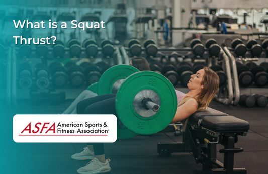A woman performing a squat thrust with a barbell in a gym, surrounded by dumbbells and workout equipment.