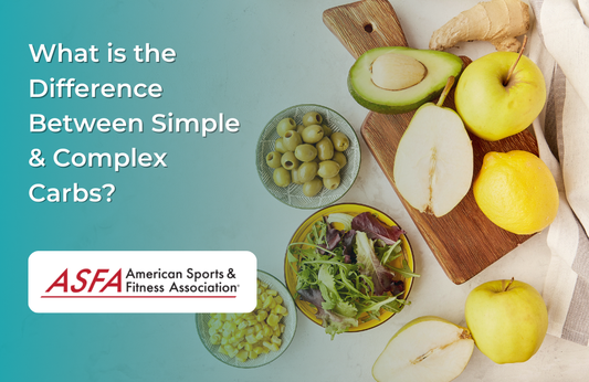 A variety of fresh fruits, vegetables, and olives arranged on a wooden board.