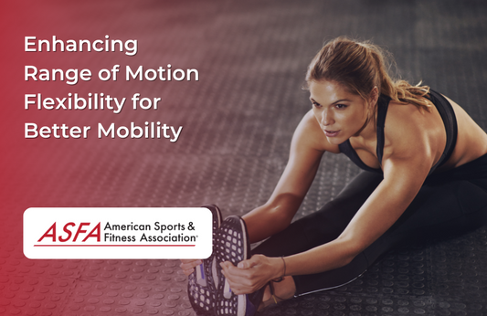 A woman stretching her hamstring on a gym floor, reaching for her toes while maintaining focus and control.