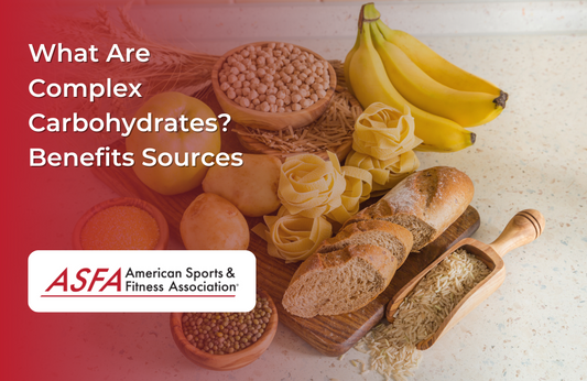 Foods such as bananas, grains, bread, and pasta on a counter top.