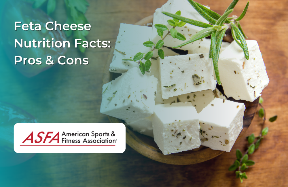 A wooden bowl filled with cubes of feta cheese garnished with fresh herbs.