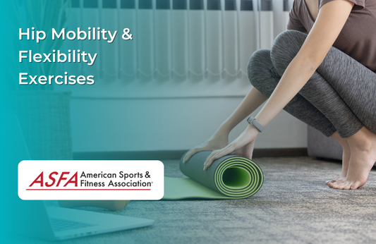 A woman rolling out a green yoga mat indoors, wearing leggings.