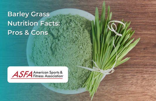 A bowl filled with powdered barley grass and fresh green barley grass stalks beside it.