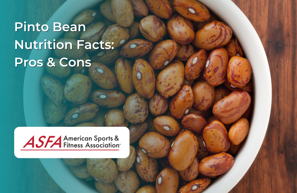 A close-up of a bowl filled with pinto beans, showing their speckled brown appearance.