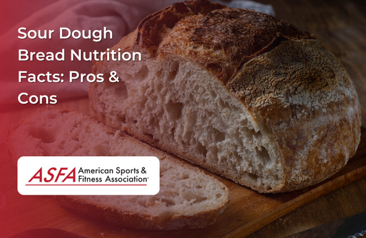 A rustic sourdough loaf with a golden crust and a slice cut out to show the airy texture inside.