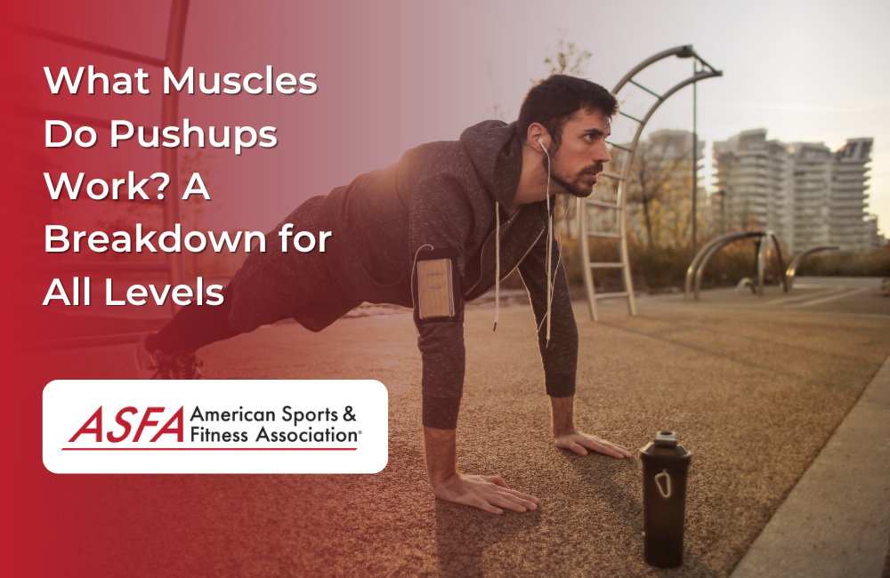 Man in hoodie doing pushups outside in a park.