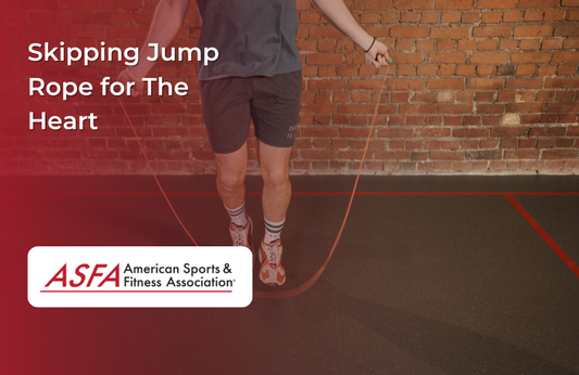 A person jumps rope indoors on a rubber floor with a brick wall background.