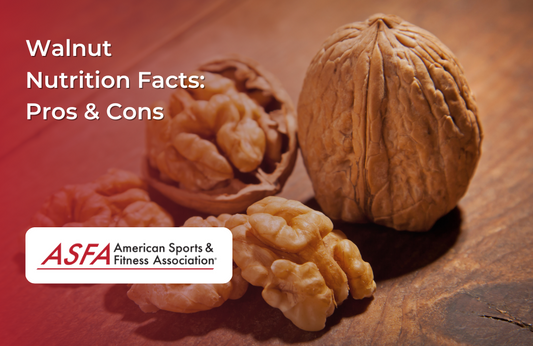 Whole and cracked walnuts placed on a rustic wooden table.