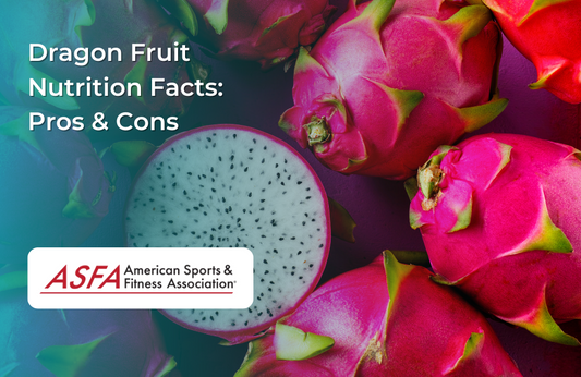 A halved dragon fruit with vibrant pink skin and white flesh speckled with black seeds, surrounded by whole dragon fruits.