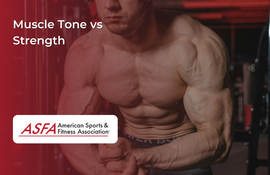 A muscular man poses shirtless in a gym with defined muscles visible.