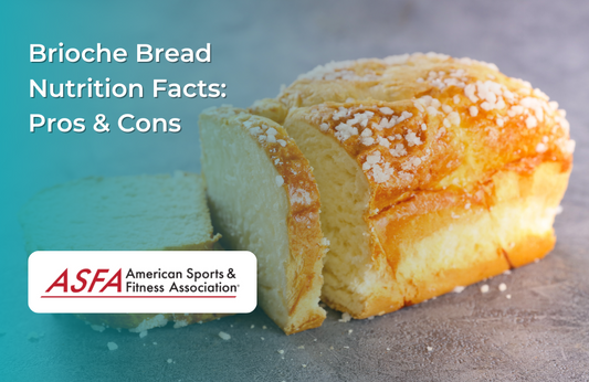 A soft brioche loaf with a golden crust and sugar topping on a gray surface.