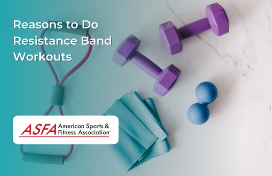 An assortment of fitness equipment, including resistance bands, small dumbbells, and massage balls, laid out on a white surface.