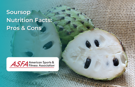 A halved soursop fruit with white flesh and black seeds on a burlap sack.